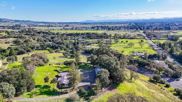 birds eye view of property with a mountain view