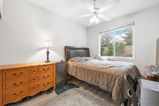 bedroom featuring ceiling fan and wood finished floors