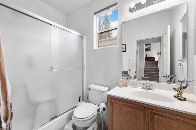 full bath with toilet, a shower stall, and vanity