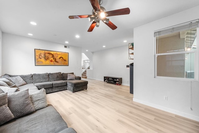 living room with recessed lighting, visible vents, stairway, wood finished floors, and baseboards