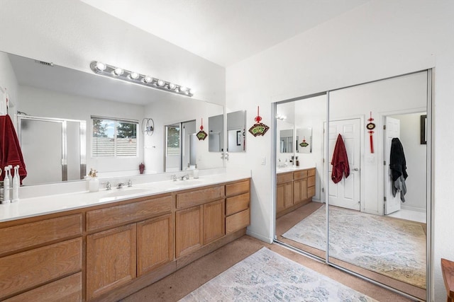 full bathroom featuring visible vents, a shower stall, and vanity