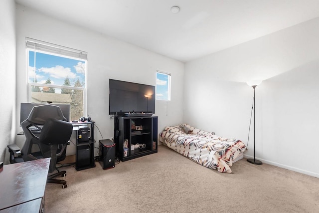 carpeted bedroom with baseboards