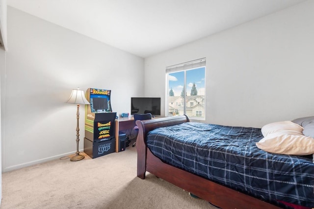 carpeted bedroom featuring baseboards