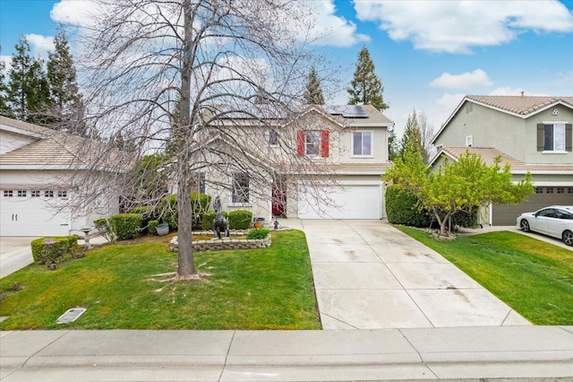 traditional-style home featuring solar panels, concrete driveway, an attached garage, a front lawn, and stucco siding