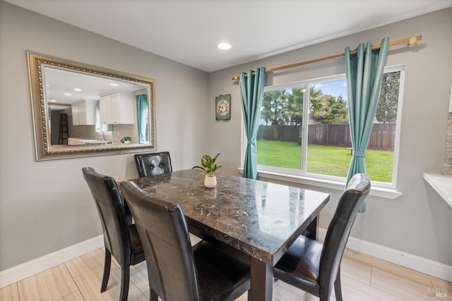 dining area with recessed lighting and baseboards