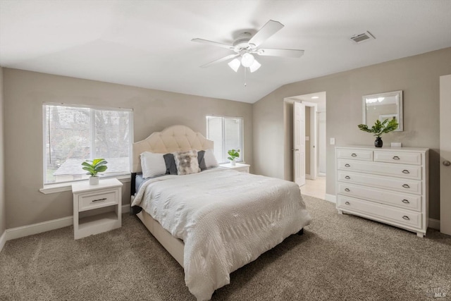 bedroom featuring light carpet, multiple windows, and visible vents