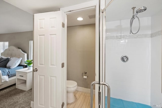 bathroom with ensuite bathroom, toilet, visible vents, baseboards, and a shower stall