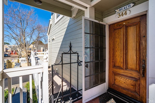 doorway to property with a residential view