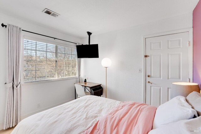 bedroom featuring visible vents