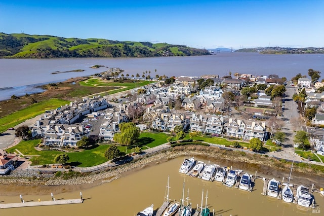 bird's eye view featuring a water view and a residential view