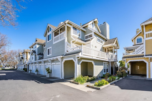 exterior space with a residential view and community garages