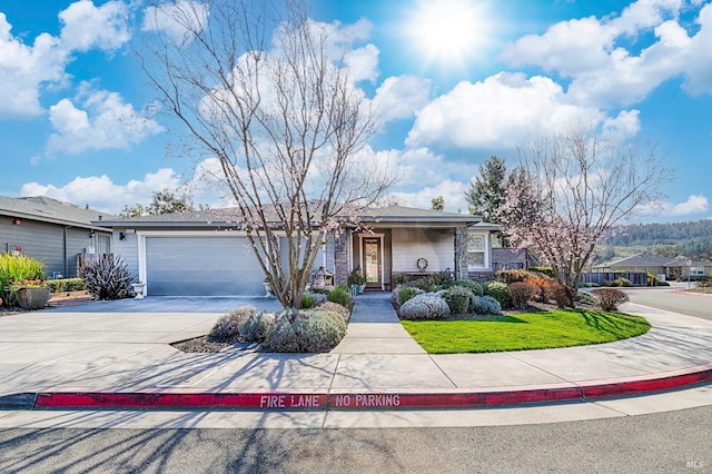 ranch-style house with concrete driveway and an attached garage