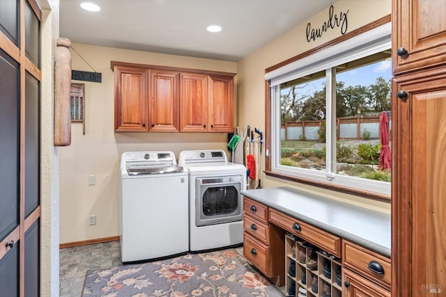 washroom with cabinet space, baseboards, washer and clothes dryer, and recessed lighting