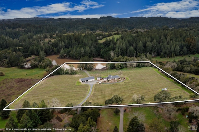 4630 Maddocks Rd, Sebastopol, CA 95472 - aerial view of sparsely populated area featuring a heavily wooded area, property parcel outlined, and a mountain backdrop