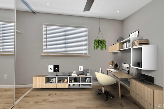 home office with light wood-style flooring, recessed lighting, a ceiling fan, and baseboards