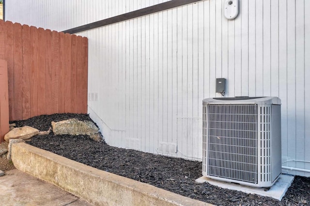 exterior space featuring crawl space, central AC unit, and fence