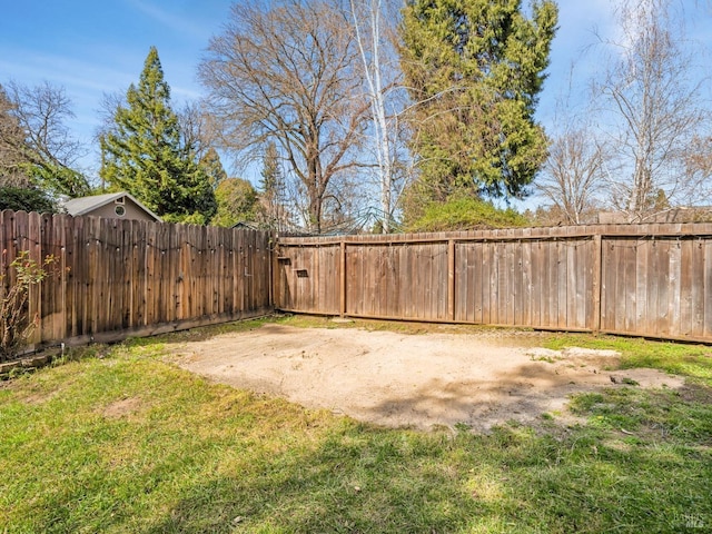 view of yard with a fenced backyard