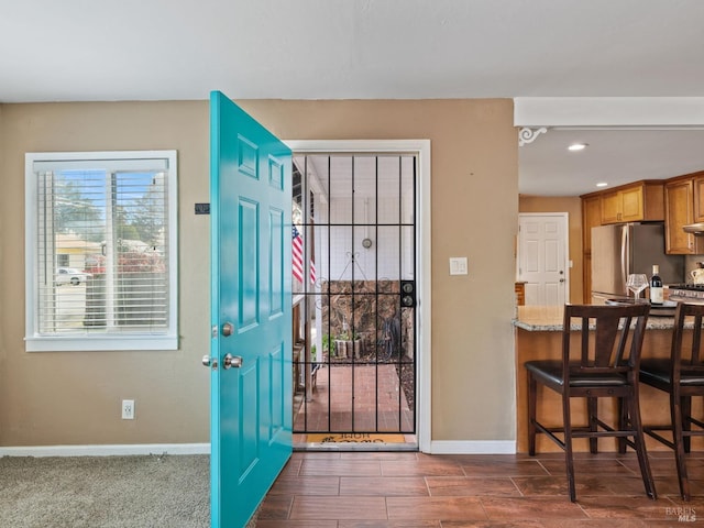 entrance foyer with recessed lighting and baseboards