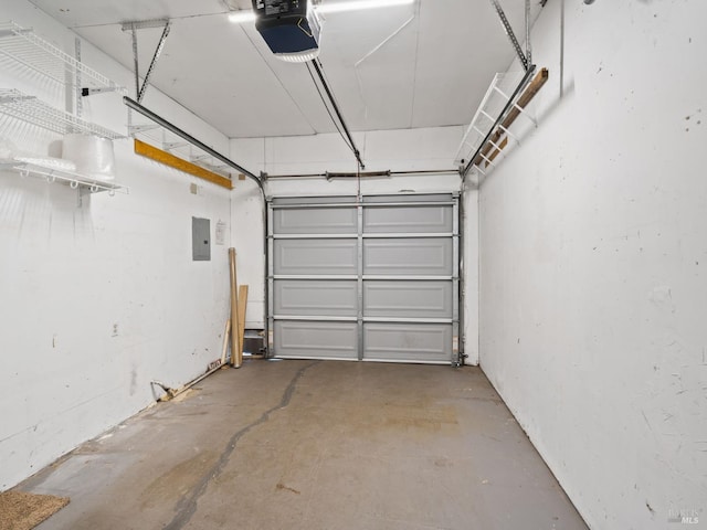 garage with a garage door opener and electric panel