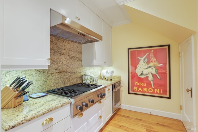 kitchen featuring appliances with stainless steel finishes, white cabinets, and under cabinet range hood