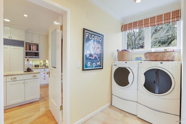 washroom featuring washer and dryer, laundry area, baseboards, and recessed lighting