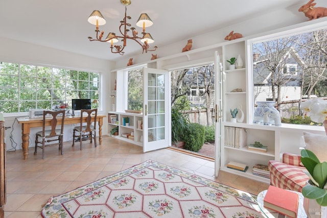 sunroom with a chandelier