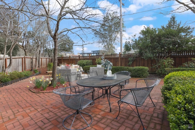 view of patio / terrace featuring a fenced backyard and outdoor dining area