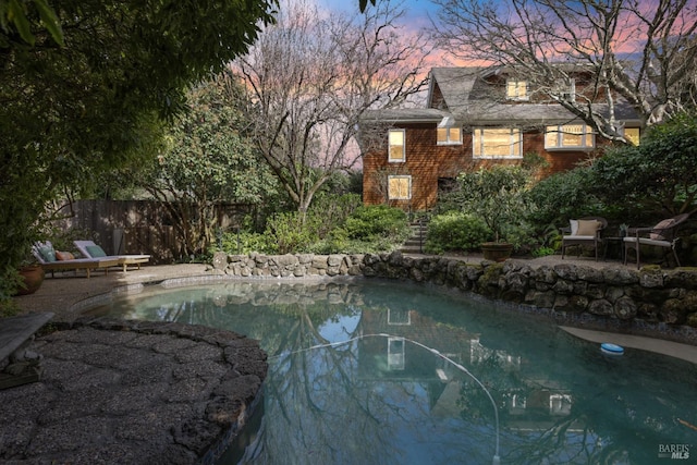 view of pool with fence, a fenced in pool, and a patio