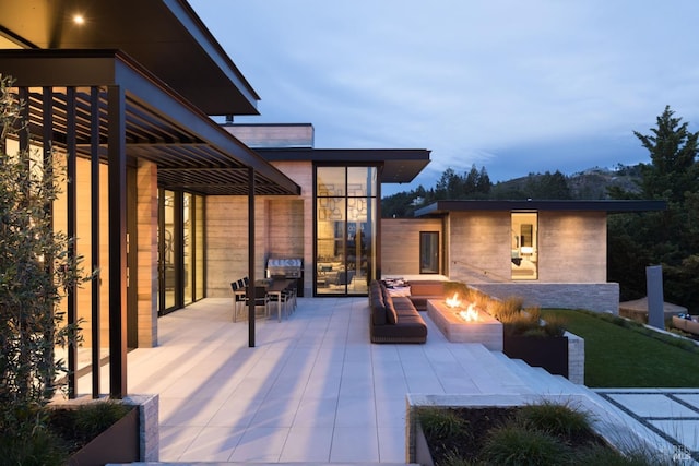 view of patio / terrace featuring a fire pit and outdoor dining space