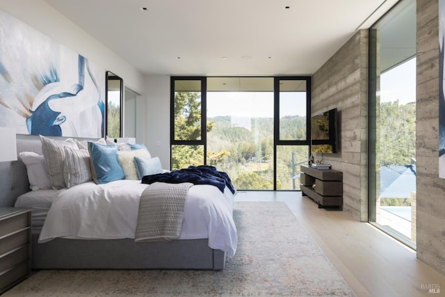 bedroom with access to exterior and floor to ceiling windows