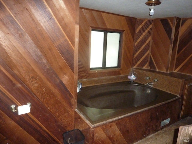 bathroom featuring wood walls