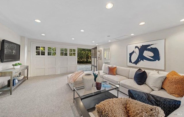 carpeted living room with recessed lighting