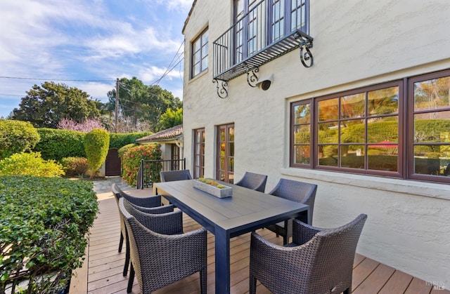 wooden deck with outdoor dining area