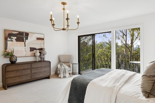 carpeted bedroom featuring a chandelier, access to outside, and baseboards