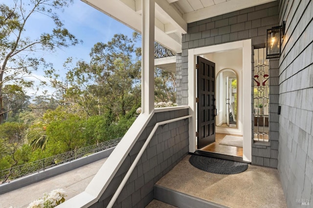 entrance to property with a balcony