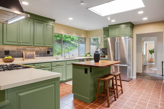 5 Madrone Ave, Woodacre, CA 94973 - kitchen featuring exhaust hood, green cabinets, a sink, and freestanding refrigerator