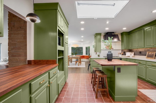 5 Madrone Ave, Woodacre, CA 94973 - kitchen featuring recessed lighting, decorative backsplash, tile patterned floors, green cabinetry, and wooden counters