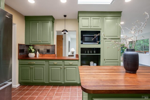 5 Madrone Ave, Woodacre, CA 94973 - kitchen featuring green cabinetry, wooden counters, freestanding refrigerator, and decorative backsplash