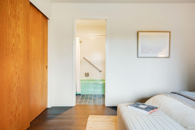 5 Madrone Ave, Woodacre, CA 94973 - bedroom with wood finished floors, baseboards, ensuite bath, and a closet