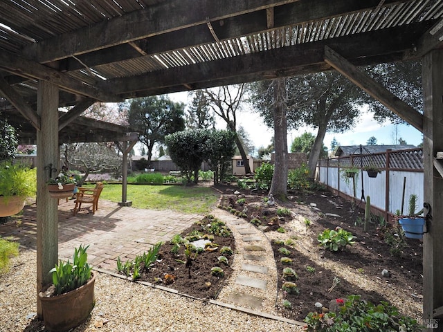 view of yard with a patio area, a fenced backyard, and a pergola