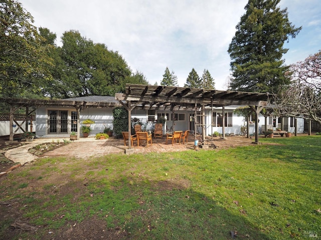 rear view of property with a patio, a lawn, and a pergola