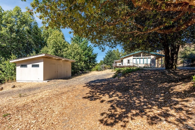 view of yard with a shed and an outdoor structure