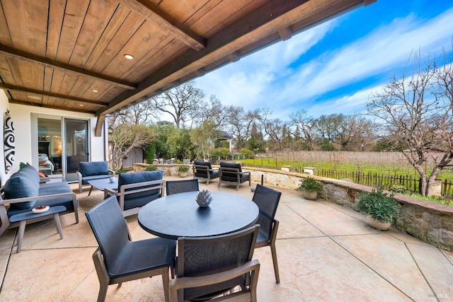 view of patio / terrace with fence and an outdoor living space