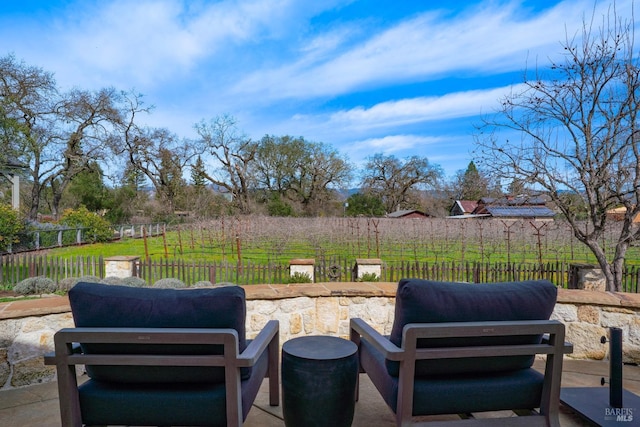 view of patio with fence and an outdoor hangout area