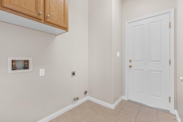 laundry room featuring hookup for a washing machine, cabinet space, hookup for an electric dryer, light tile patterned flooring, and baseboards
