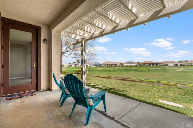 view of patio featuring a residential view and a pergola