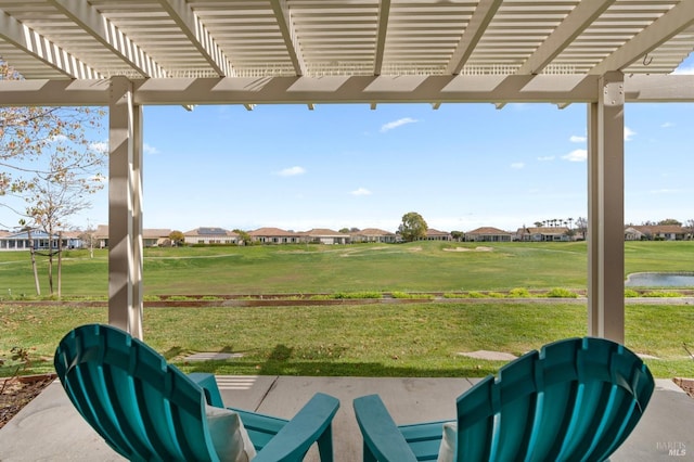 view of patio / terrace featuring a residential view and a pergola