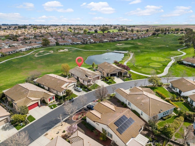 aerial view featuring a residential view, a water view, and golf course view
