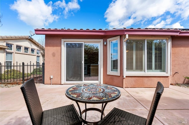 view of patio featuring fence