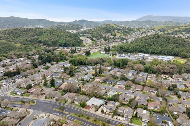 drone / aerial view featuring a residential view and a mountain view